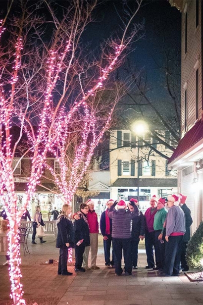 Christmas carolers gather in Kings Court