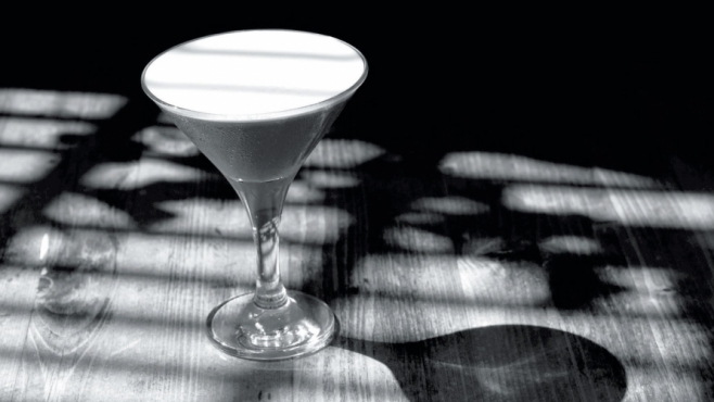 black and white photo of a cocktail - film noir feel