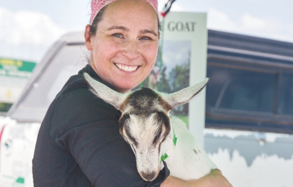 Woman holding goat