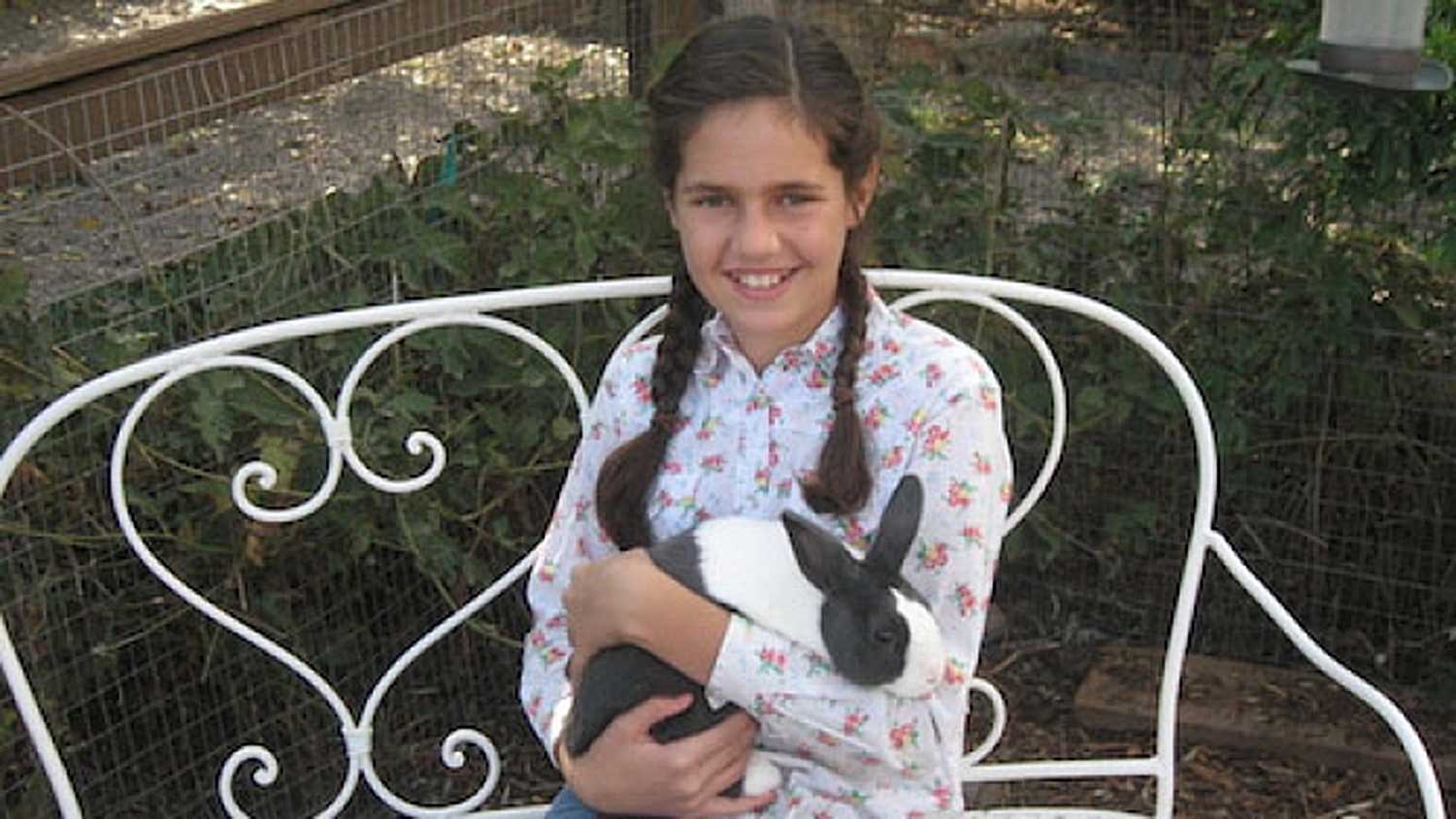 girl holding rabbit